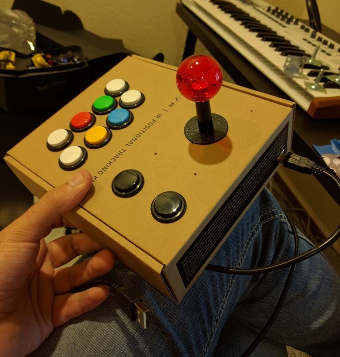 A finished fight stick built out of a small cardboard box